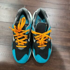 New Balance Kids' Black and Teal Sneakers with Orange Laces